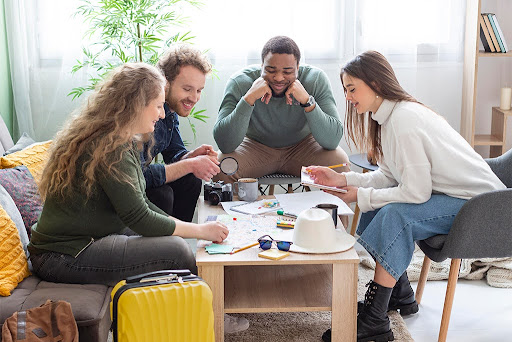 Group of friends discussing travel plans together