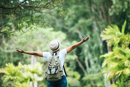 Tourist enjoying nature while on an eco-friendly trip