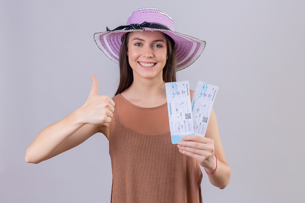 Traveler smiling after booking his ticket.